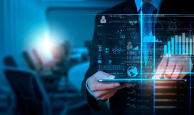 man-in-a-suit-standing-behind-a-hologram-of-data-analytics man-in-a-suit-standing-behind-a-hologram-of-data-analytics