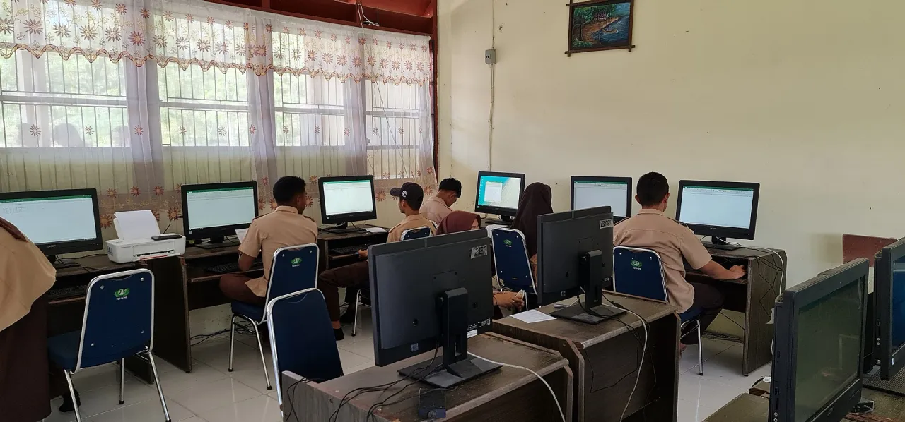 Group of students learning computer skills